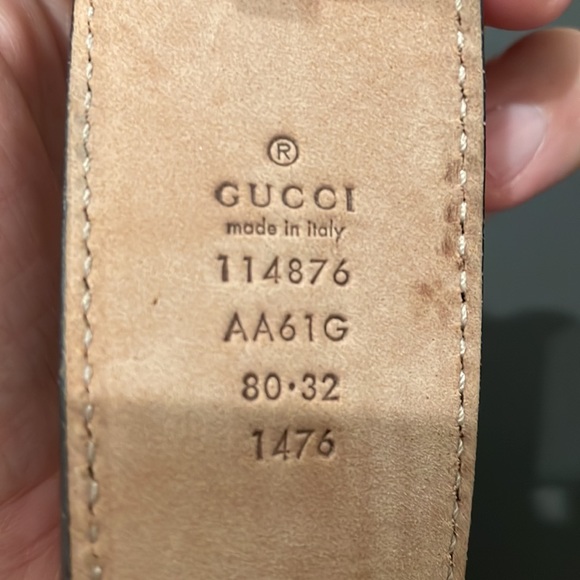 Black Gucci Interlocking G belt with gold buckle and Gucci print